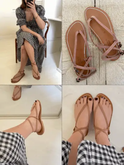 Pair of Saint Laurent Tribute Slide Sandals on raffia background.