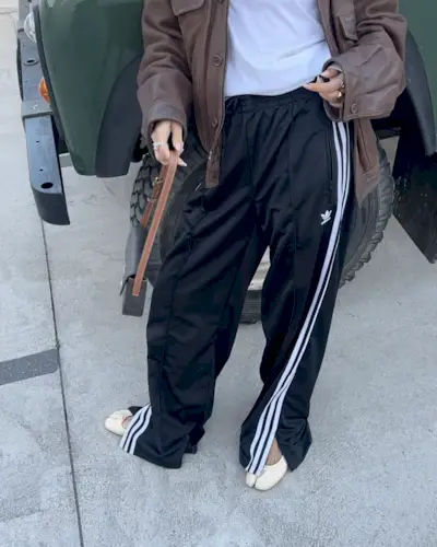 a fashion collage featuring three stylish women wearing Adidas track pants