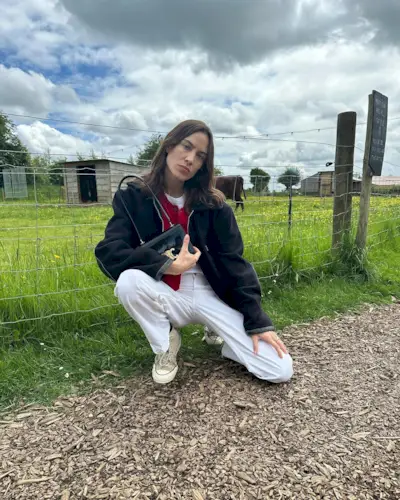 Alexa Chung wears converse trainers.