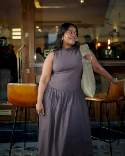 Woman wears brown summer dress