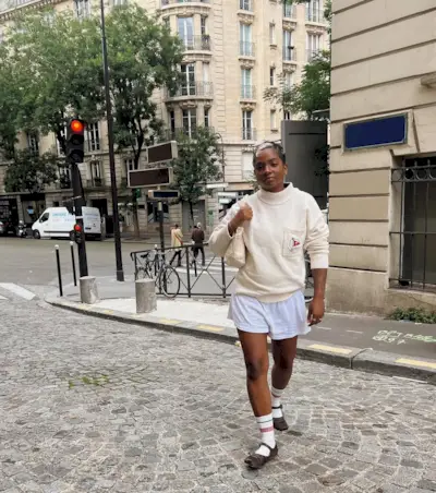 woman wearing white boxer shorts and ballet flats