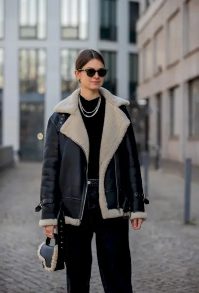 a photo of a woman wearing the italian bag brand atp atelier