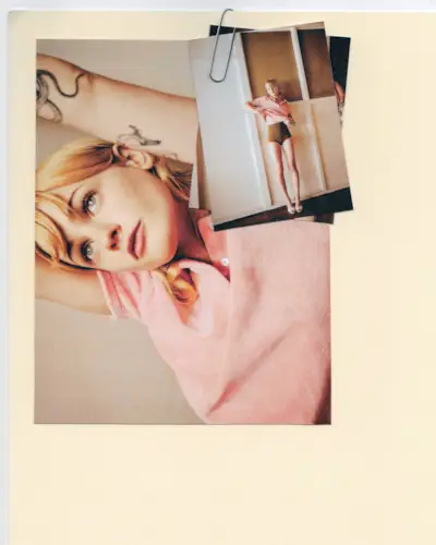 Photos of Esther McGregor paper-clipped to a manila folder. In the photos, Esther is wearing a pink polo shirt with brown briefs and white mules.