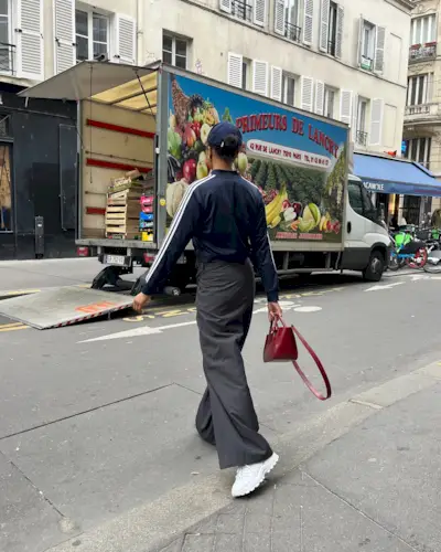 Woman wearing chunky sneakers in Paris.