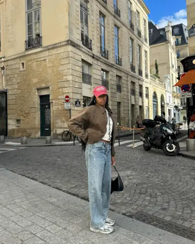 Woman wearing chunky sneakers in Paris.