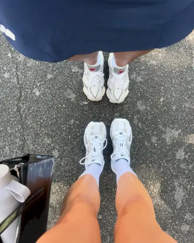 Woman wearing chunky sneakers in Paris.