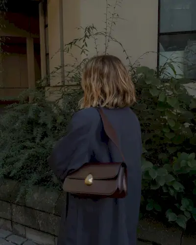 @ brittanybathgate wearing a brown Neous bag