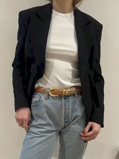 Black blazer and white tee worn with jeans and a camel-colored Madewell belt with gold hardware.