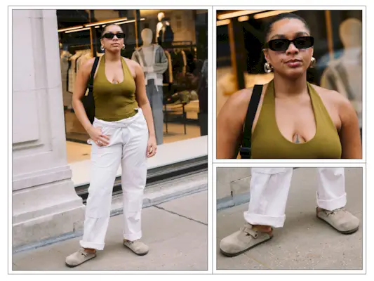 A woman wears a green halterneck top, linen trousers and Birkenstock Boston clogs