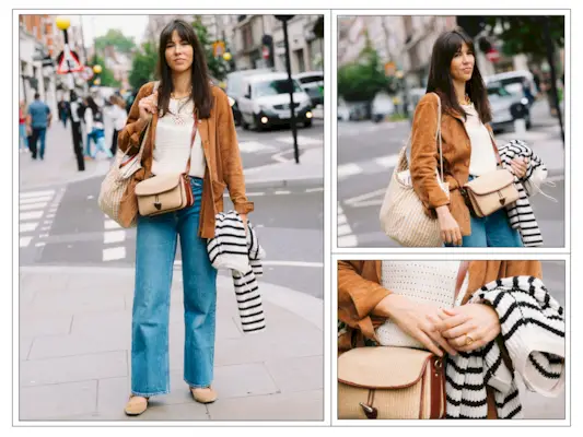 A woman wears blue jeans, a tan suede bag and a stripe knit in London