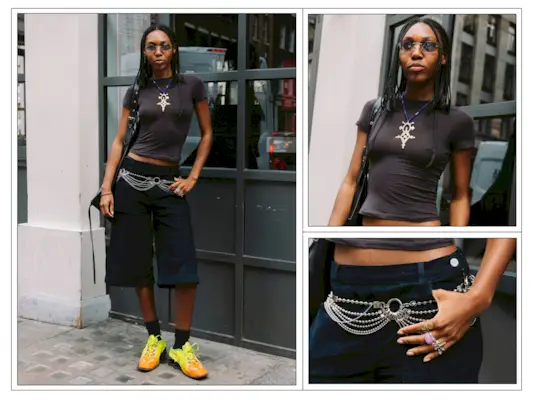 A woman wears yellow trainers and dark blue Bermuda shorts in London
