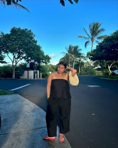 Marina in black monochrome outfit and red jelly sandals