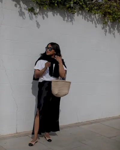 Shoes to wear with satin skirts: @chiarasatelier wears a black satin skirt with two-tone ballet flats and a white T-shirt