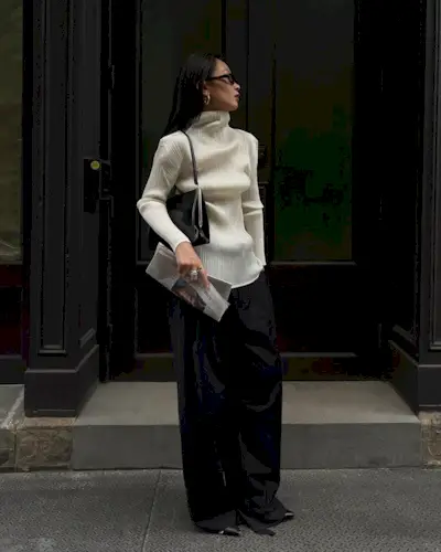 Caroline wearing black wide-leg trousers