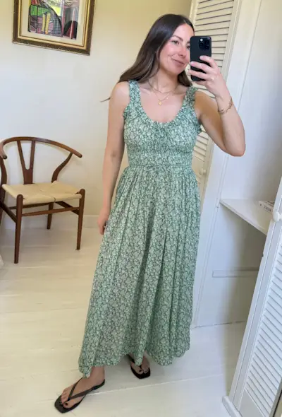 Woman wears floral Doen dress