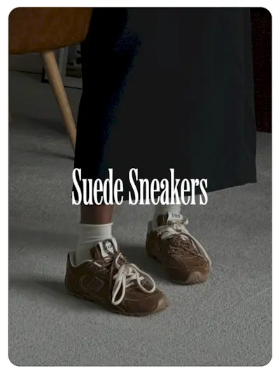 A photo of @nlmarilyn wearing brown Miu Miu suede sneakers.