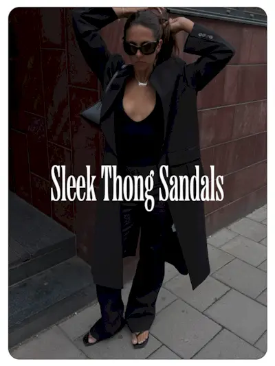 A photo of Hanna MW wearing a black outfit with sleek thong sandals.