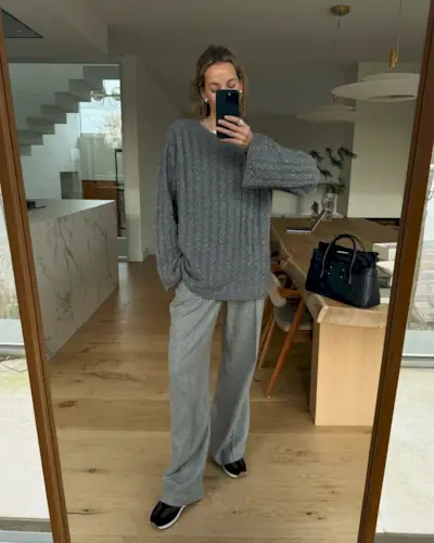 Fashion influencer @anoukyve wearing a chic spring outfit with on-trend sneakers.