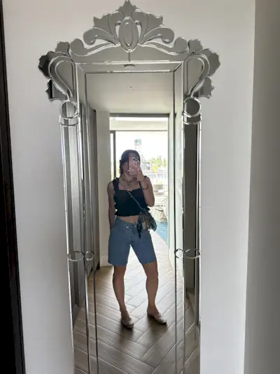 Girl in clear shoes taking a selfie