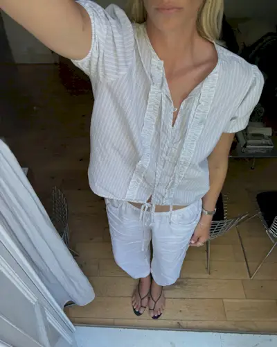 Woman wears pretty summer blouse