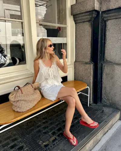 woman wears pretty summer blouse