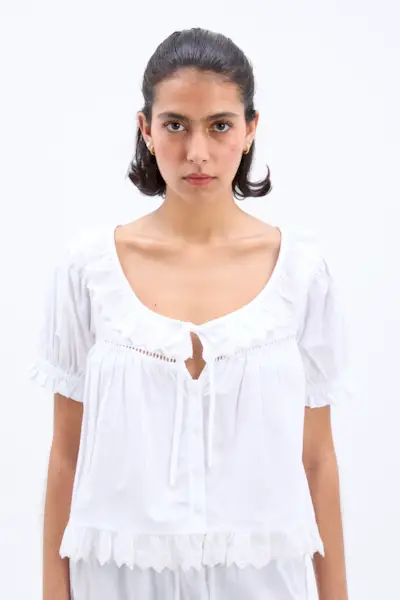 Woman wears pretty summer blouse