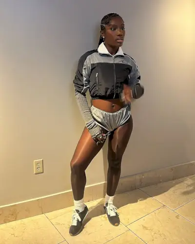 Doechii wearing a Miu Miu outfit.