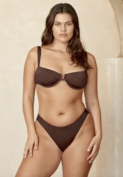 Raeann Langas wearing printed bikini with belly chain.