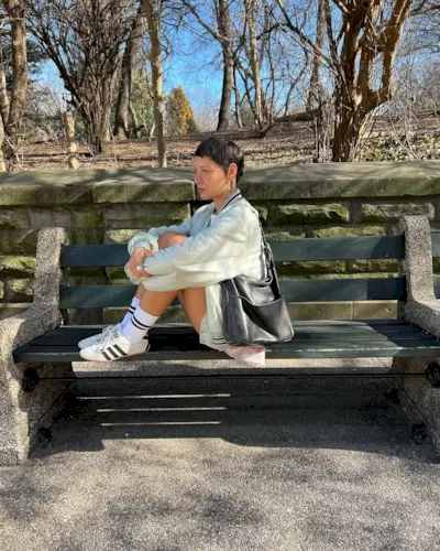 Aisha wearing Adidas Tokyos and sporty white ensemble