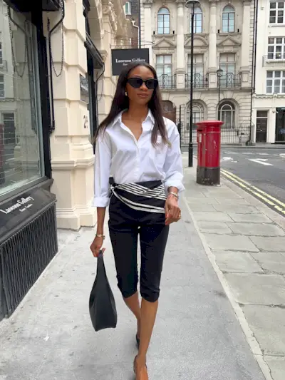An image of @symphonyofsilk wearing a white button-down with capri pants and a scarf belt, an example of what to wear instead of skinny jeans.
