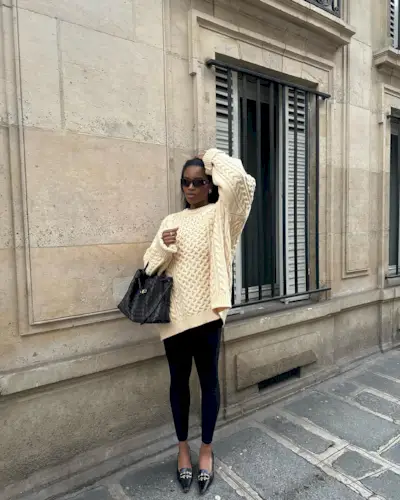Fashion influencer @nlmarilyn wears a chic outfit with basic black leggings.