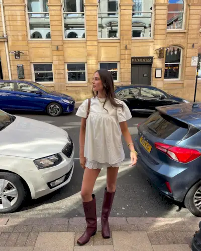 Influencer Eabha O'donoghue in wine red Cos boots lace skirt and Babydoll top from My Mum Made It.