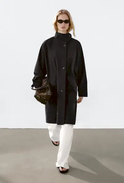 @johannapiispa wears a collarless shearling coat from Toteme with black trousers and leather loafters.