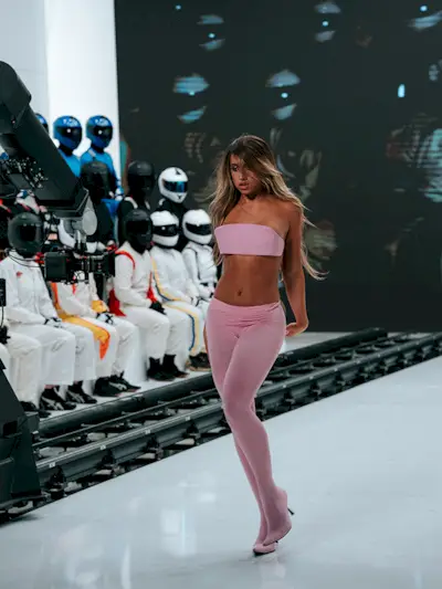 Tate McRae wearing Balenciaga bandeau, leggings, and heels.