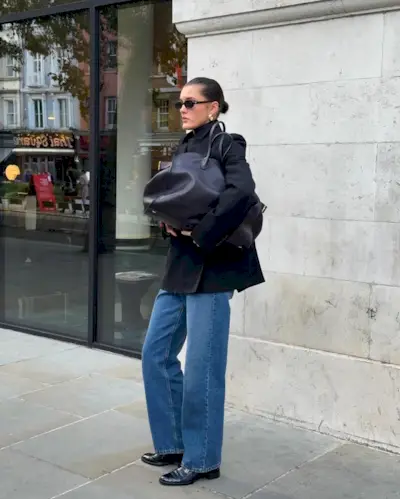 Influencer carries a bowling bag