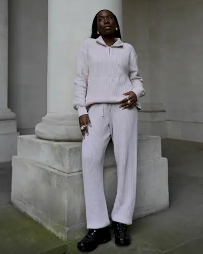 Danielle Jinadu wearing a waffle-knit set including a pullover sweater and drawstring pants.