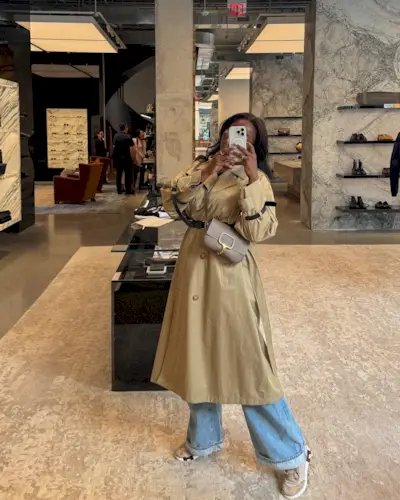 Coco Bassey wearing sneakers.