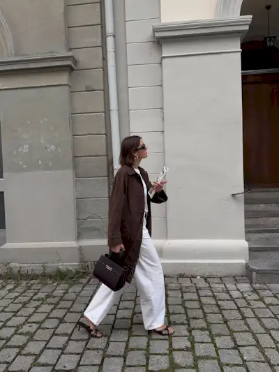 woman wearing brown suede jacket trend