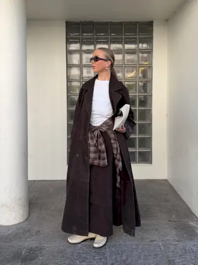 woman wearing brown suede jacket trend