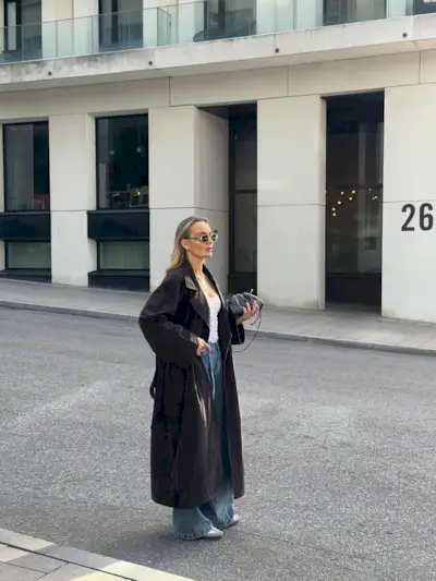 woman wearing brown suede jacket trend