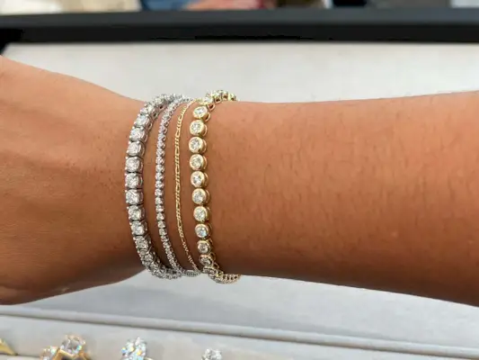 Woman wearing tennis bracelets.