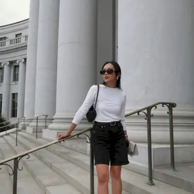 @dawn.tan wearing black denim shorts and a long-sleeved top