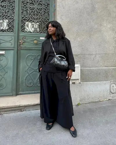 Franny in black ballet pumps and all-black outfit