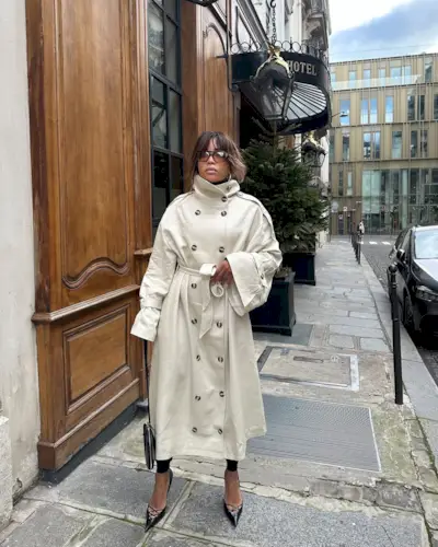 Ellie in a trench and heels