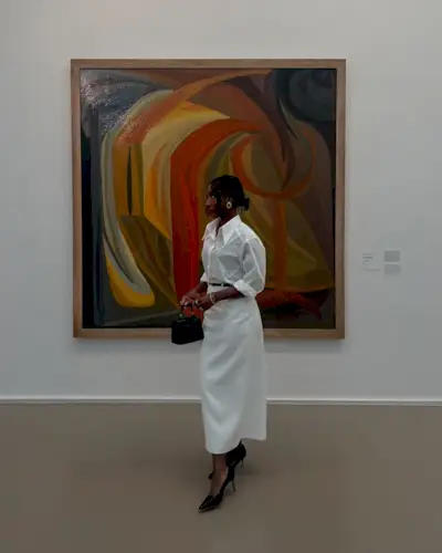 Adida in a white skirt and blouse