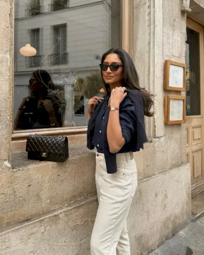 An image of @cocobeautea carrying one of the most popular designer handbags.