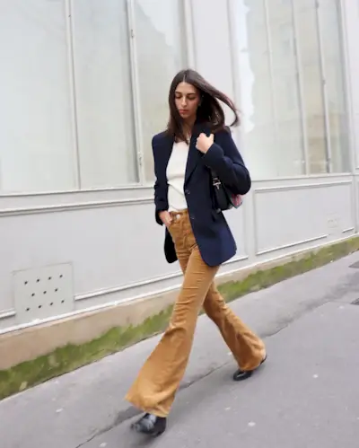 Woman wearing flared corduroy pants.