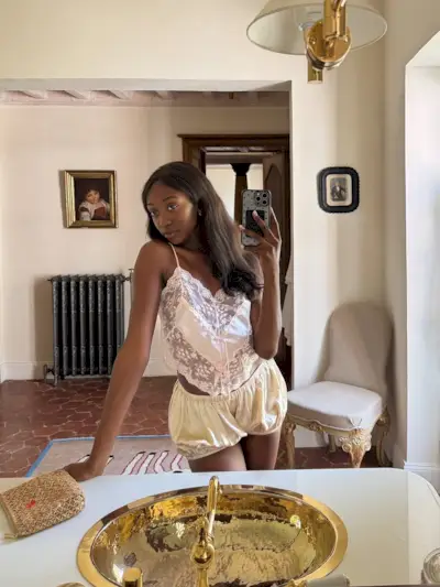 Woman wearing the silk shorts trend.