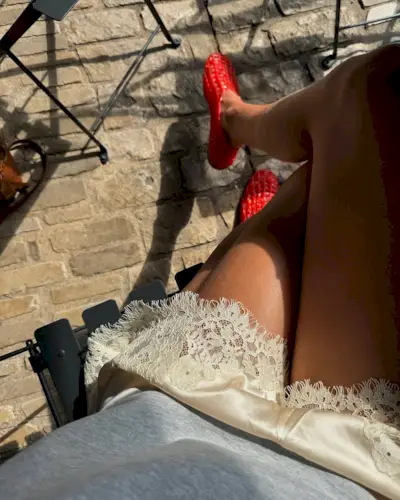 Laura Vidrequin wearing Doen lace silk shorts.