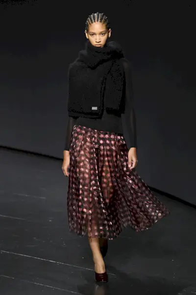 Model wears burgundy heels.